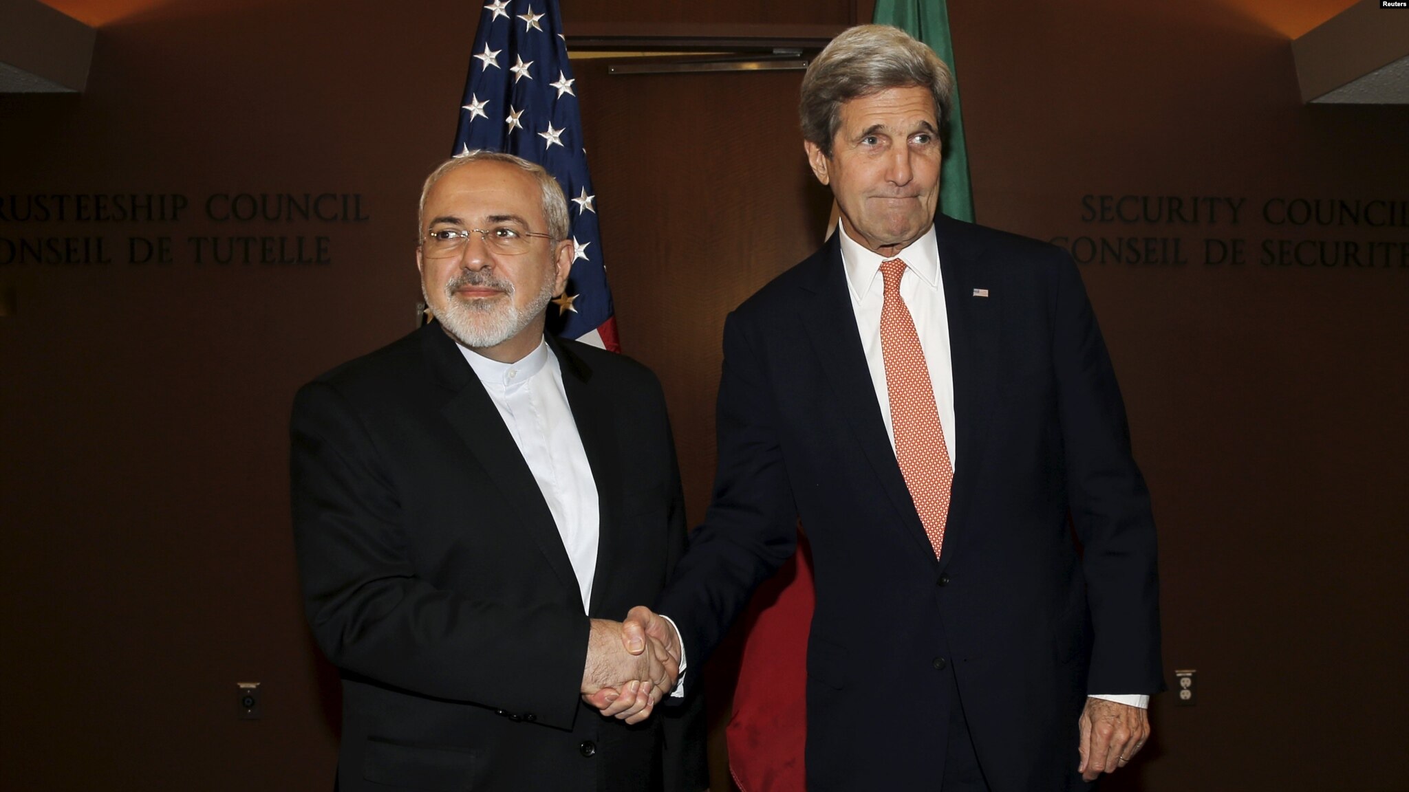 Iranian Foreign Minister, javad Zarif, shaking hands with the U.S. Secretary of State, John Kerry, at the United Nations in New York